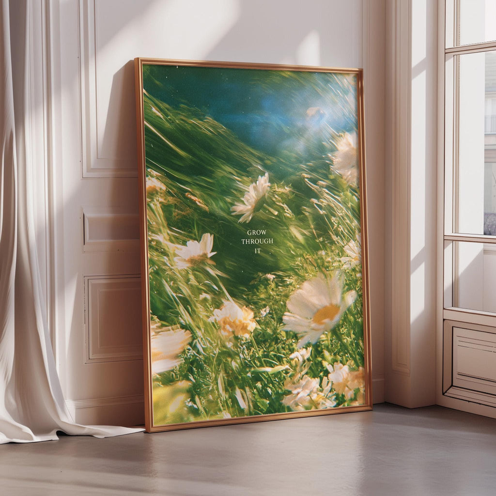a large framed poster with a vibrant, nature-inspired scene of flowers and greenery.