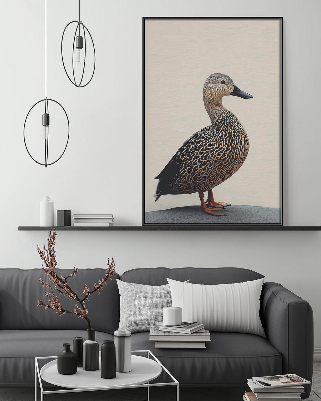 a gray couch with a white pillow, a coffee table with various decorative items, and a large framed picture of a duck on the wall above the couch.