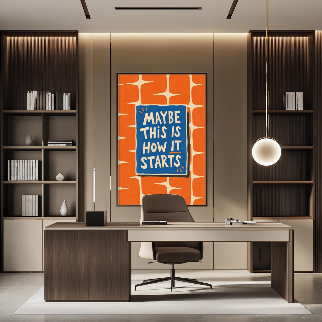 a modern office space with a desk, chair, and a large framed poster on the wall with the text "MAYBE THIS IS HOW IT STARTS".