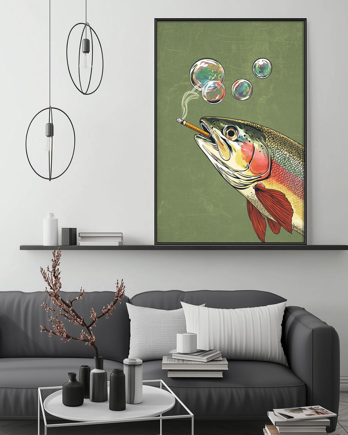 a large fish painting hanging on a wall above a gray couch in a living room setting.
