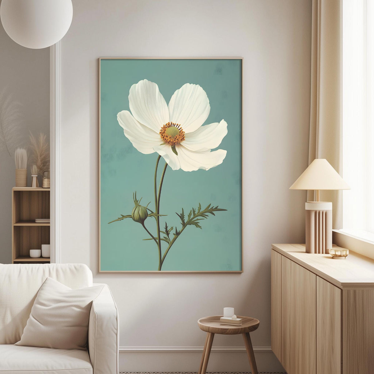 a living room with a large white flower painting hanging on the wall, a white sofa, a wooden side table, and a lamp on a wooden cabinet.