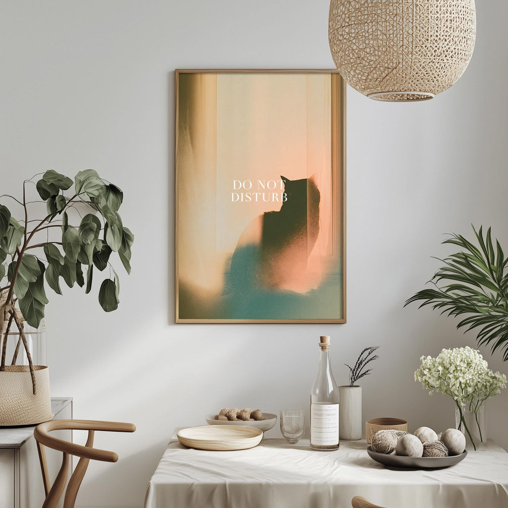 a dining table with a bowl of fruit, a bottle, and a vase of flowers, along with a framed poster with the text "DO NOT DISTURB" hanging on the wall above the table.