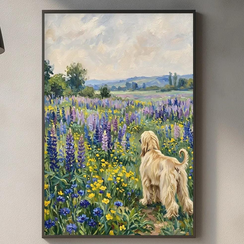 a painting of a dog in a field of flowers hanging on a wall above a kitchen counter.