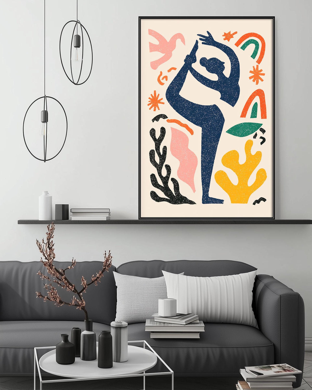 a modern living room with a gray sofa, a coffee table, and a large abstract painting hanging on the wall above the sofa.