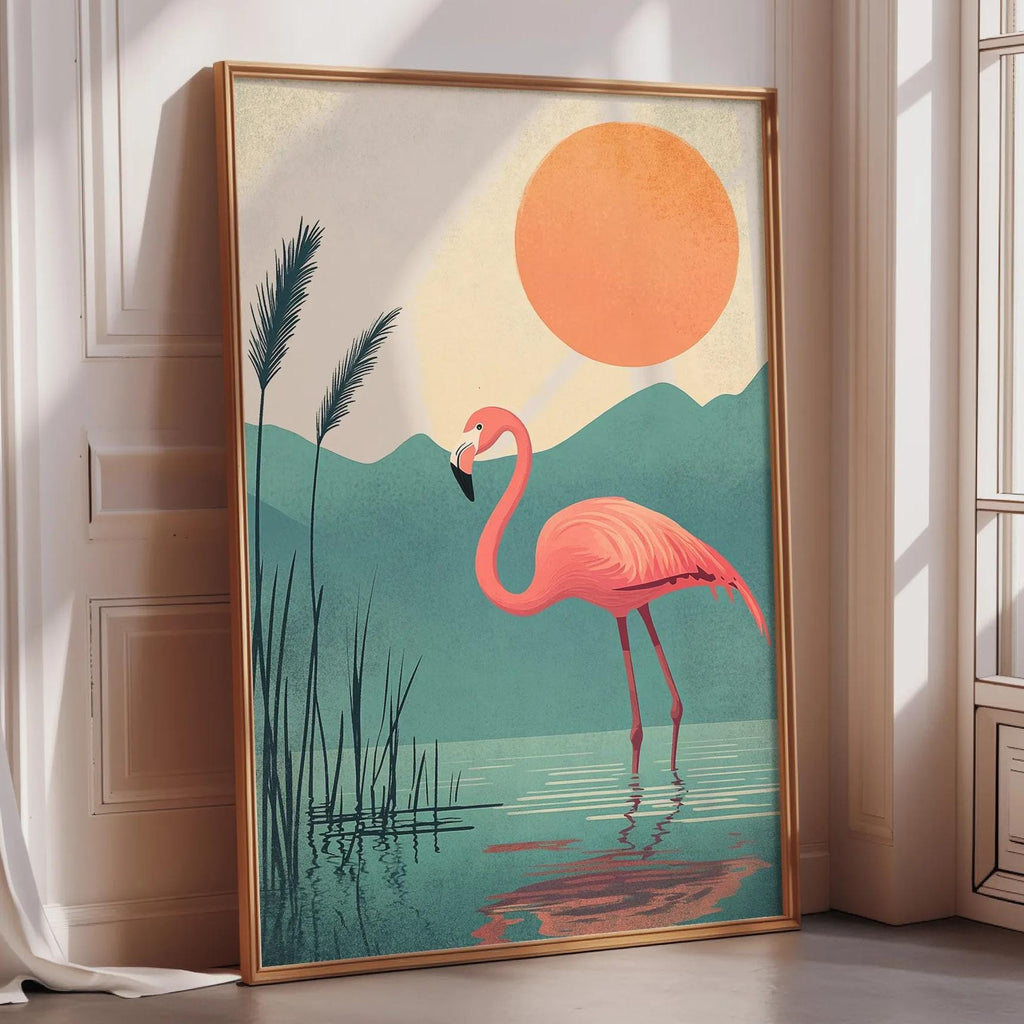 A framed illustration of a pink flamingo standing in a body of water, with a large orange sun in the background.