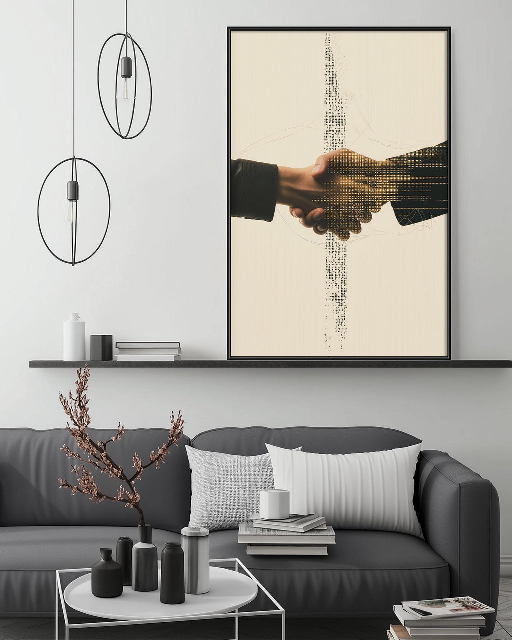 a modern living room with a gray sofa, a coffee table, and a large framed artwork depicting two hands shaking above the sofa.