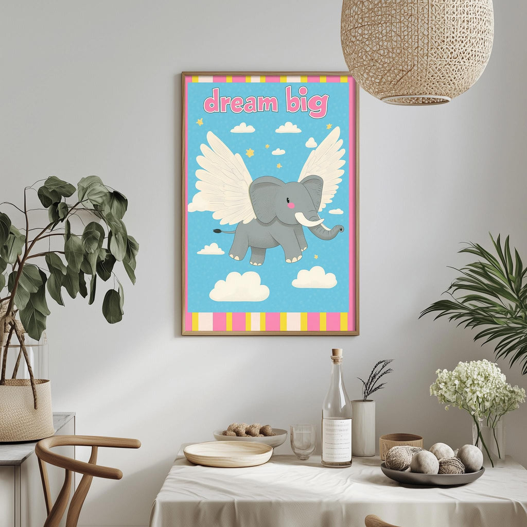 a framed poster of an elephant with wings, hanging on a wall above a table with various items on it.