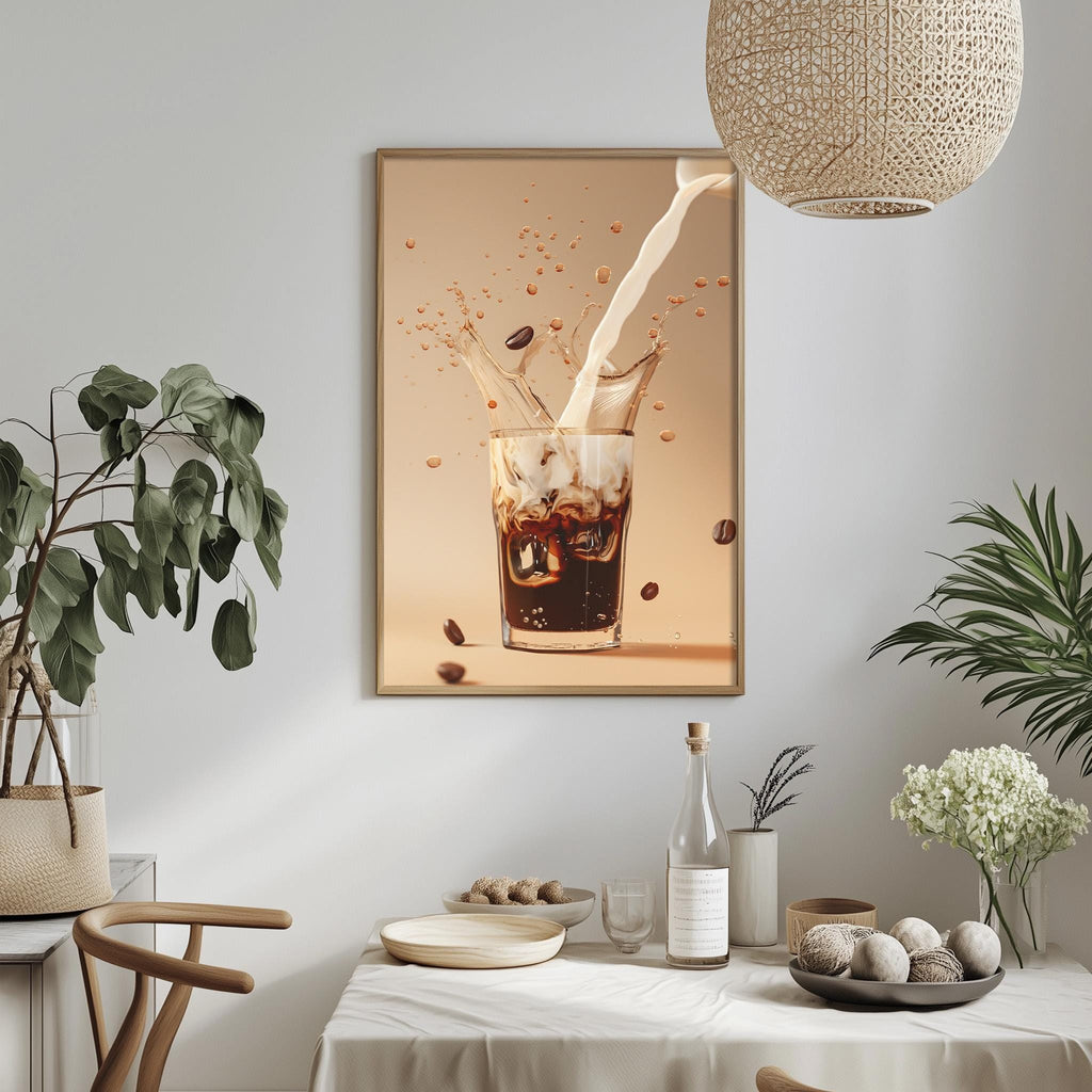 a dining table with a white tablecloth, a bowl of fruit, a bottle, and a plant. A framed picture of a glass of coffee is hanging on the wall above the table.