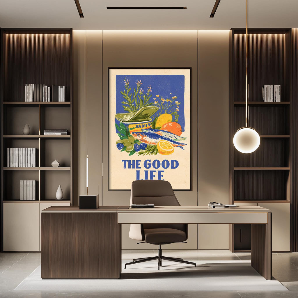 a modern office space with a large framed poster on the wall that says "THE GOOD LIFE". The poster displays an illustration of various fruits and vegetables, including oranges, apples, and bananas. The office has a wooden desk and chair, and there are bookshelves on either side of the desk. A hanging light fixture is also visible in the room.