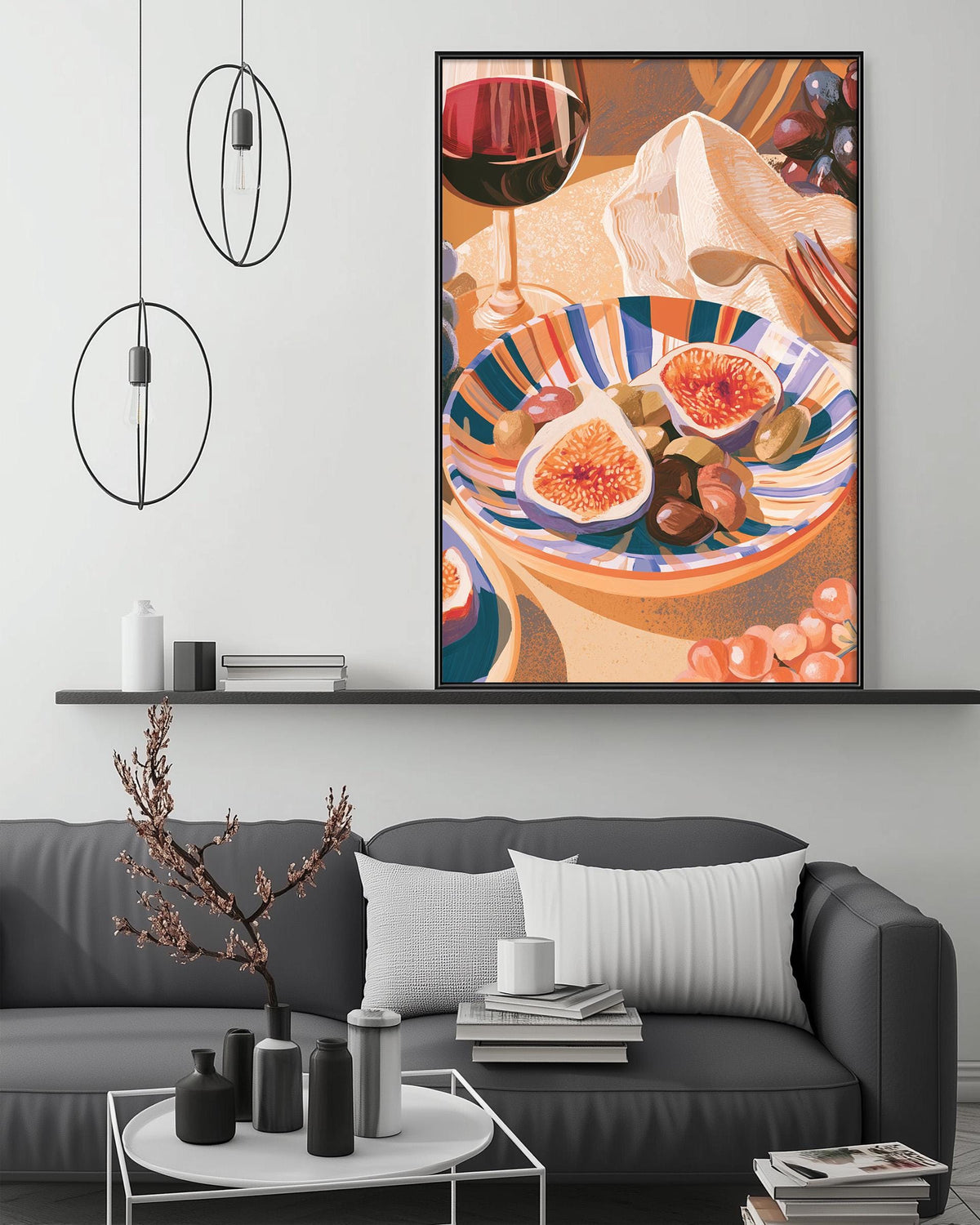 a cozy living room with a gray sofa, a coffee table, and a large framed painting of a plate of fruit hanging on the wall above the sofa.