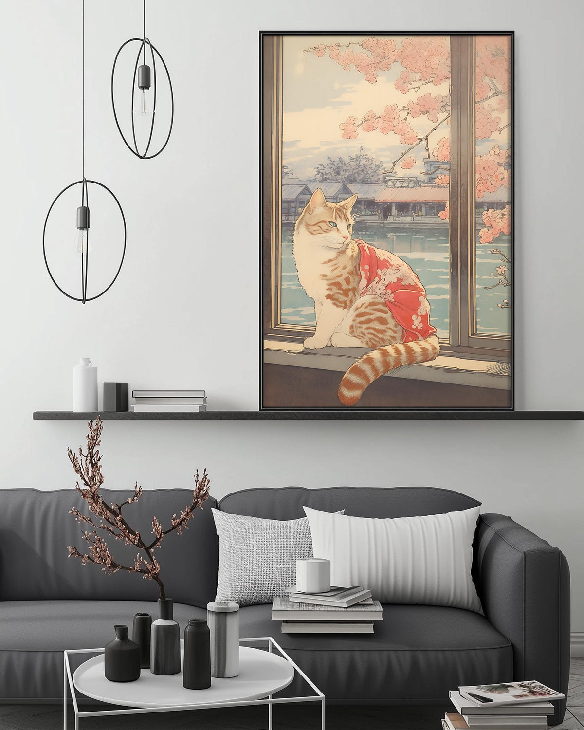 a large framed painting of a cat sitting on a windowsill, with a serene landscape of trees and a body of water in the background. The painting is hung on a wall above a gray couch, which has a coffee table in front of it. The room also includes a shelf with decorative items, and a potted plant on the floor.