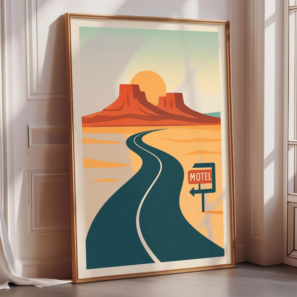 A framed poster depicting a desert landscape with a winding road leading to a motel sign.