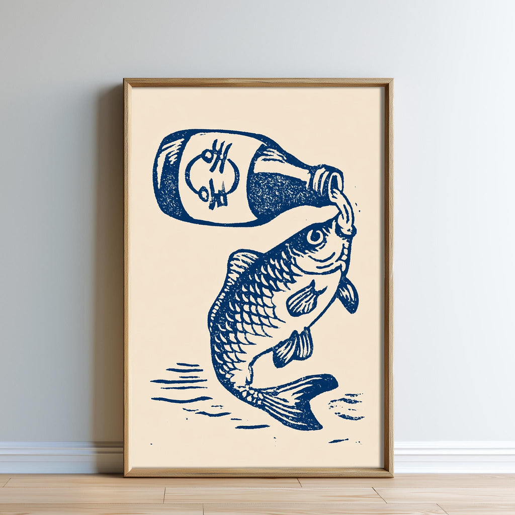 The image is a framed print depicting a fish pouring a liquid, possibly a sauce, from a bottle into its mouth.
