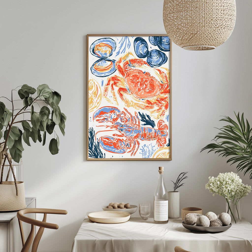 a dining table with a white tablecloth, a bowl of fruit, a bottle, and a vase with flowers. Above the table, there is a framed print of a colorful illustration of a lobster and other seafood.