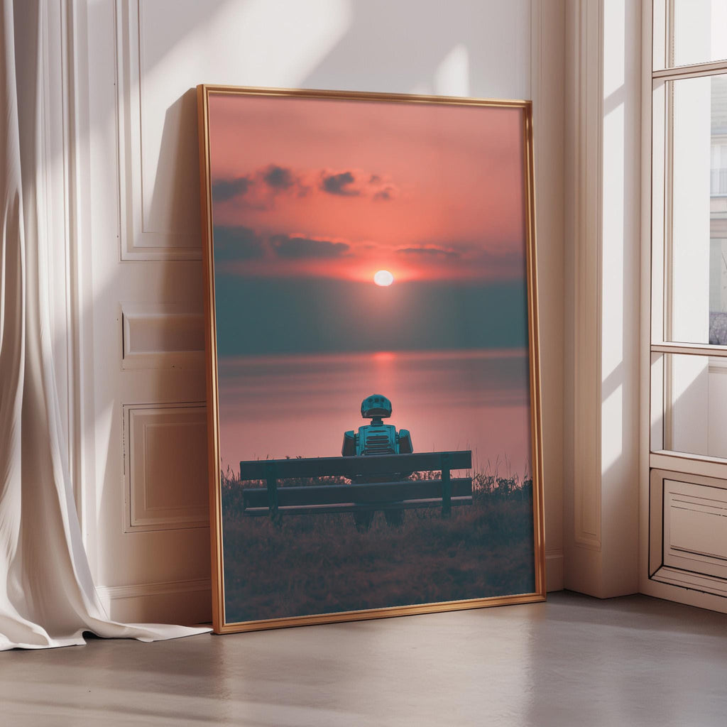 A large framed poster depicting a robot sitting on a bench, facing a sunset over a body of water.