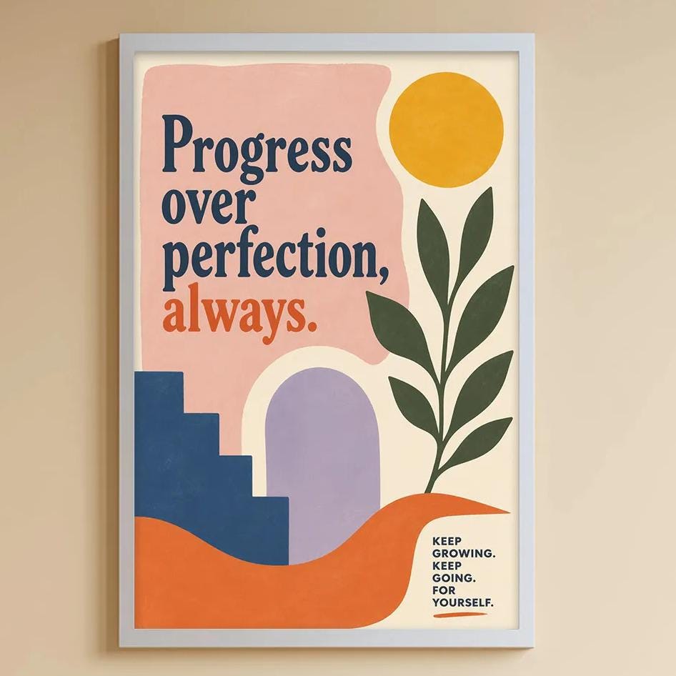 a child's bedroom with a white bookshelf, a stuffed rabbit, and a colorful poster on the wall. The poster features a sun and a plant, along with the text "Progress over perfection, always."