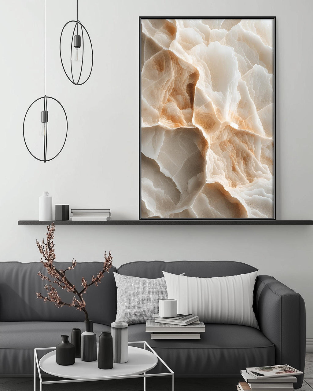 a modern living room with a gray sofa, a coffee table, and a large abstract painting hanging on the wall above the sofa.