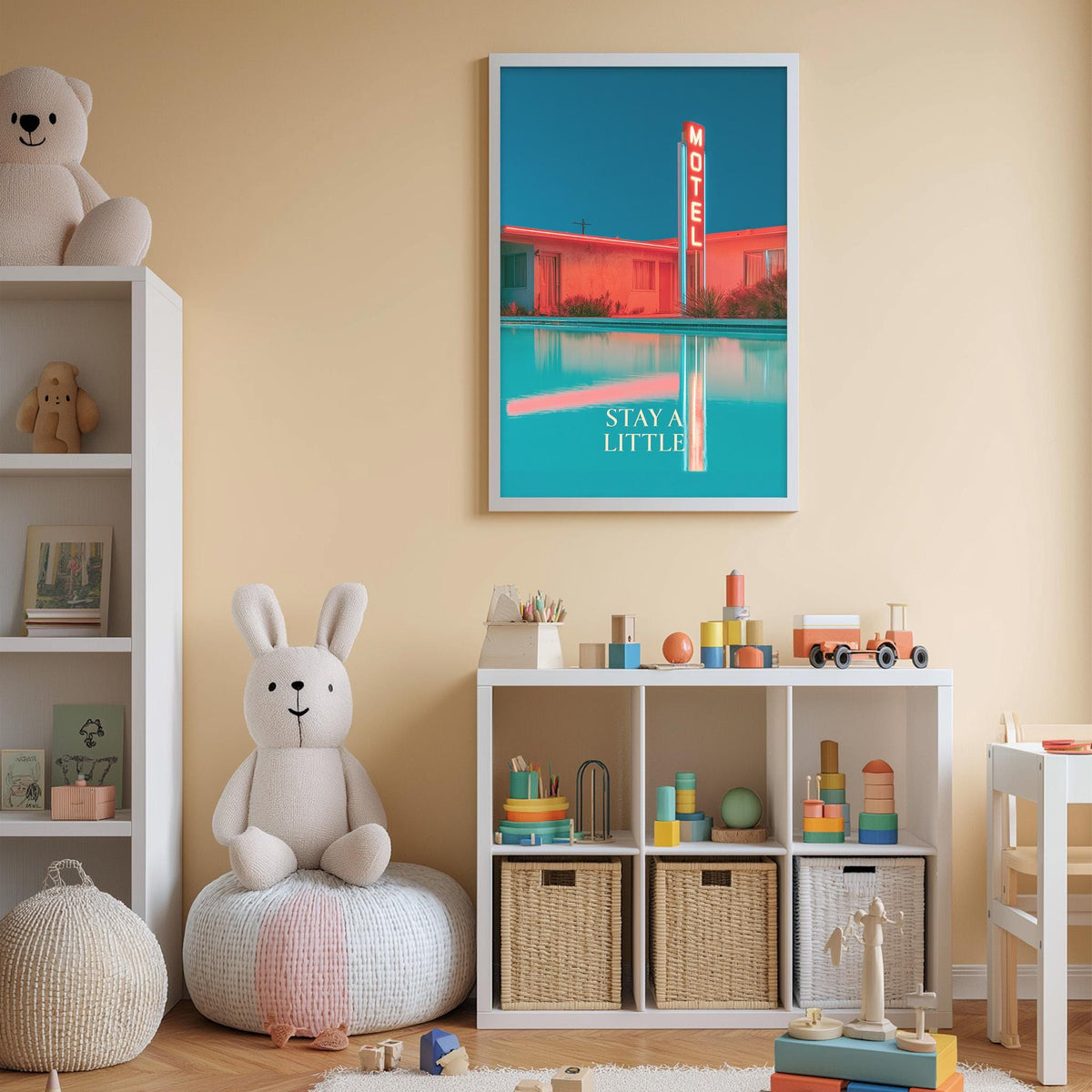A child's bedroom with a white rabbit sitting on a bean bag chair, surrounded by various toys and a bookshelf. A framed poster of a motel is displayed on the wall, and a shelf holds additional toys and books.
