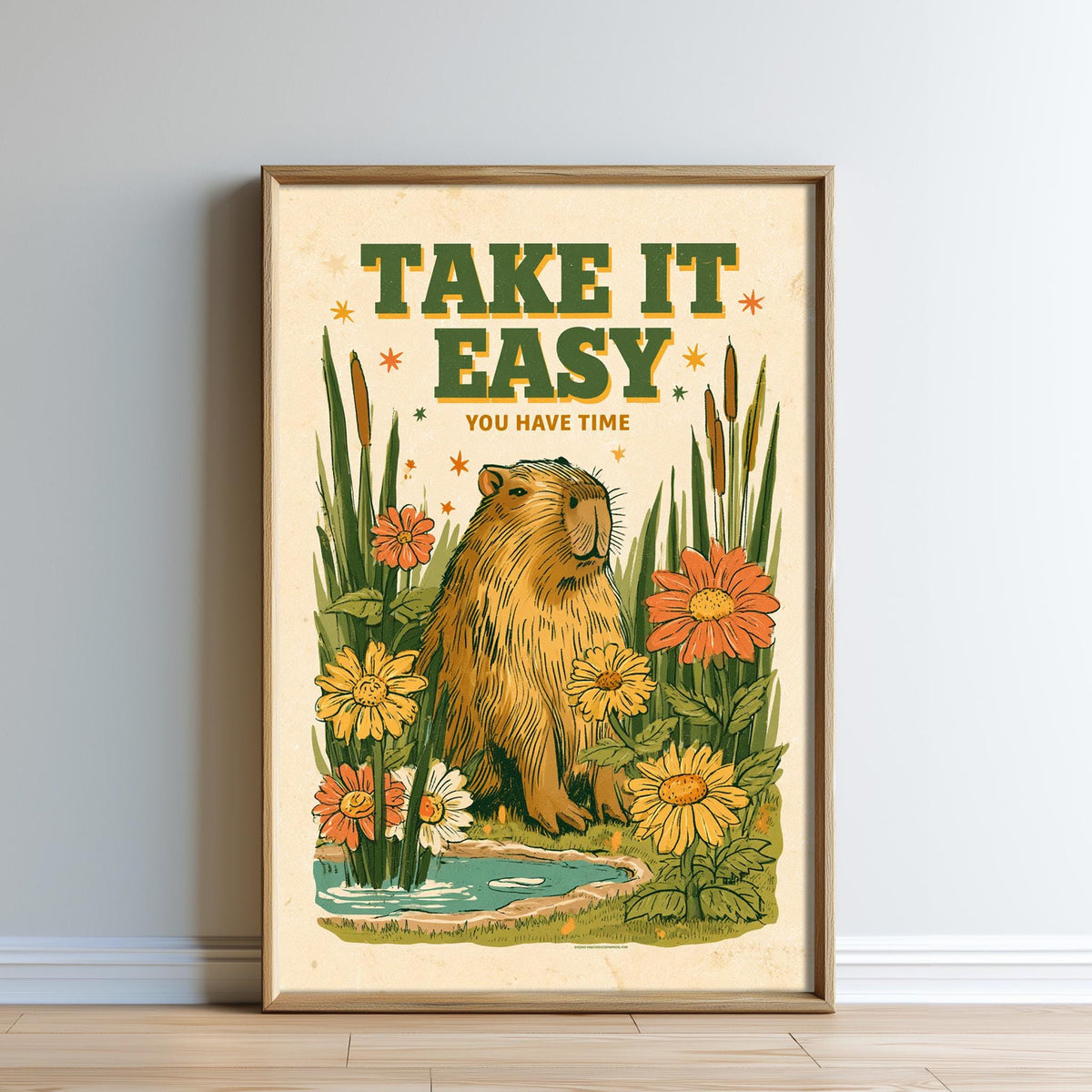 The image is a framed poster with a cartoon image of a beaver surrounded by flowers and plants, along with the text "TAKE IT EASY YOU HAVE TIME" displayed prominently.