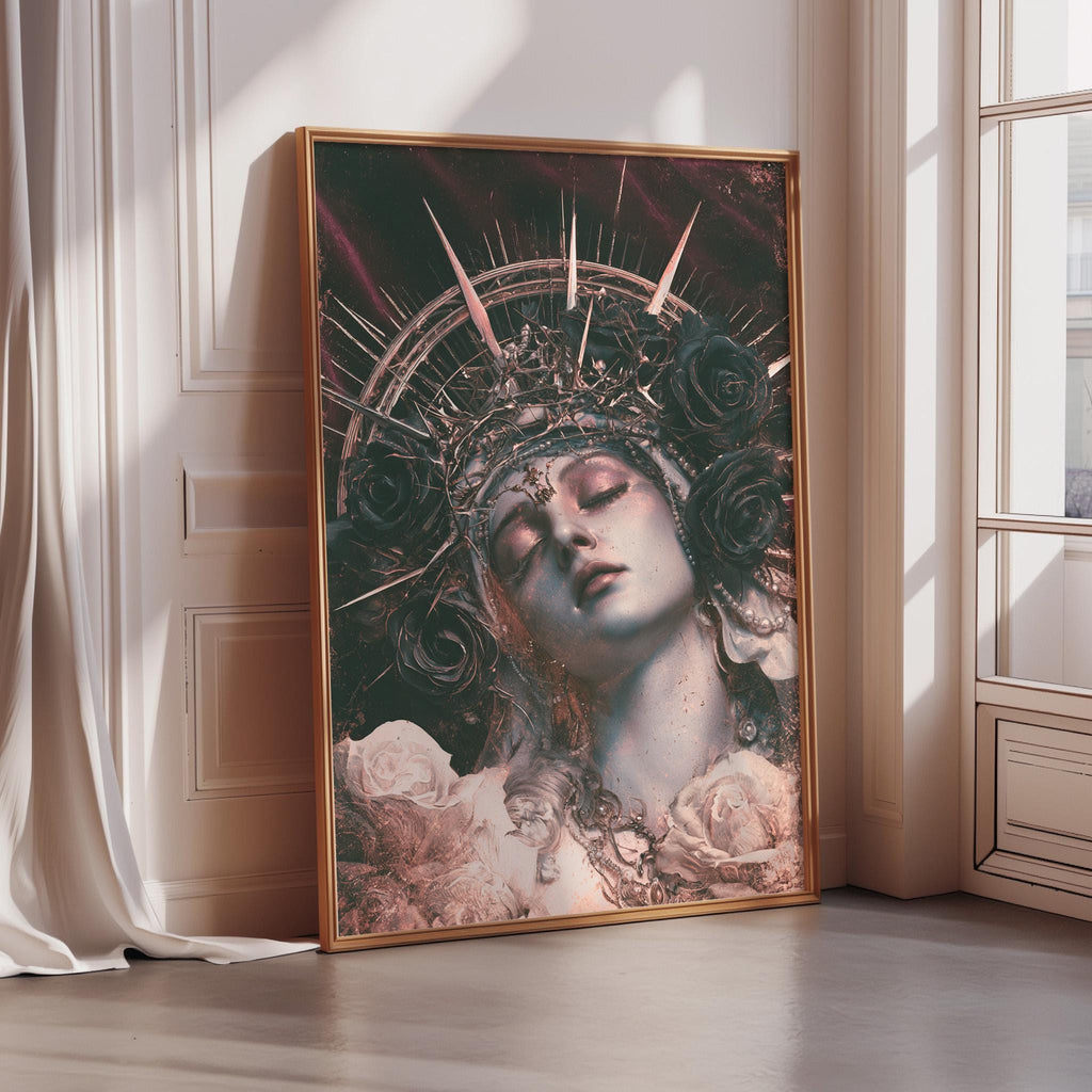a large framed artwork depicting a woman's face with a crown and floral elements, placed on a wooden floor against a white wall.