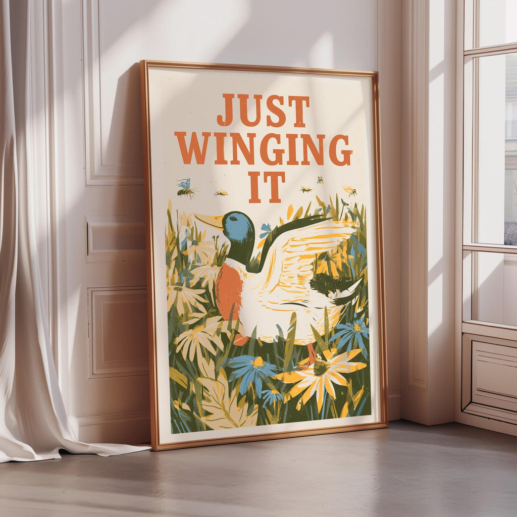 a framed poster with a colorful illustration of a duck surrounded by flowers and plants.