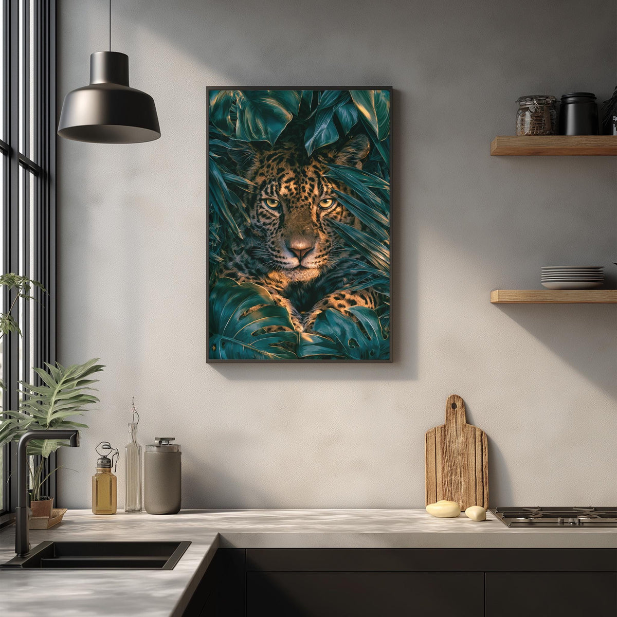 a large framed picture of a jaguar resting in a lush green environment, hanging on a wall above a kitchen counter.