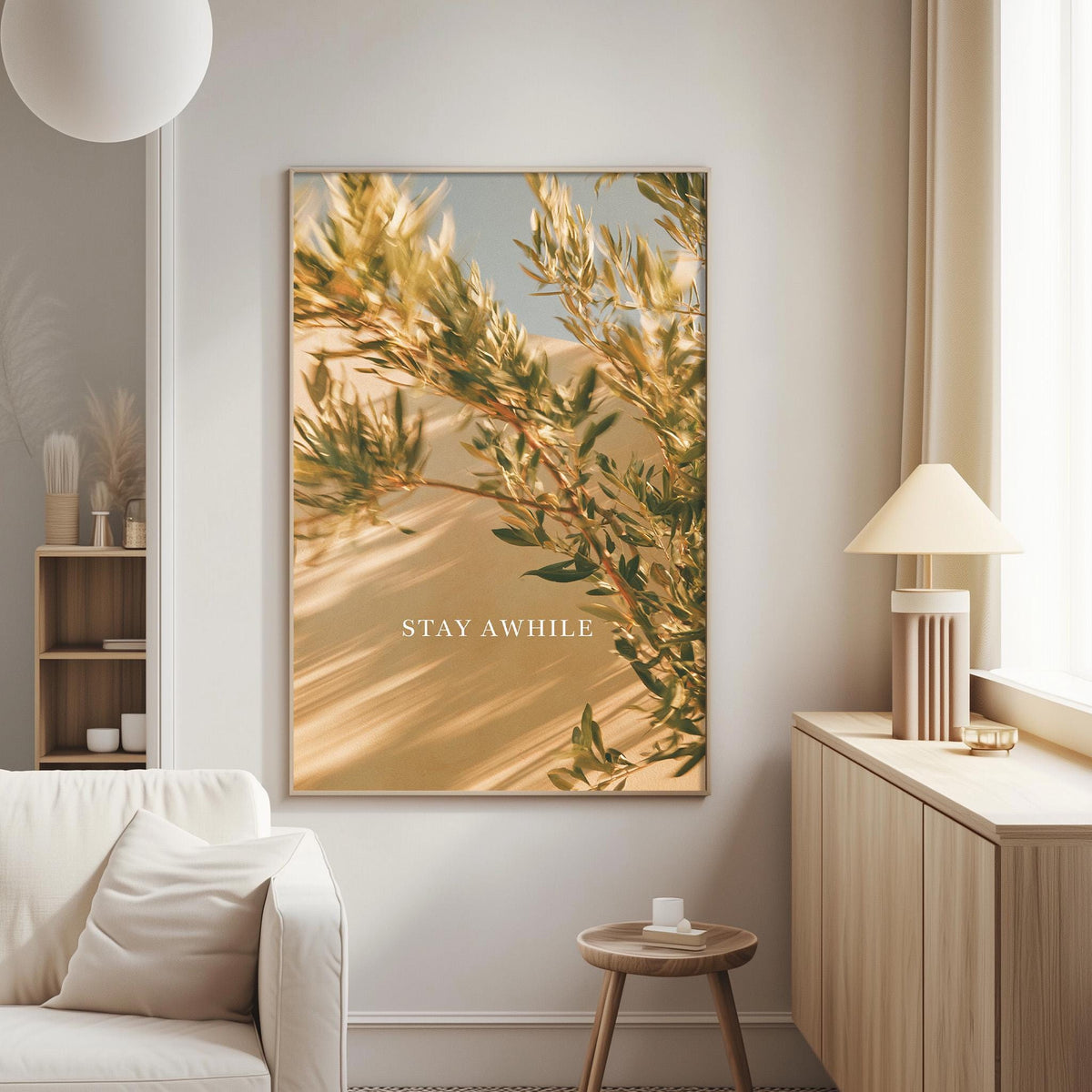 a living room with a large framed picture of a tree branch with green leaves and the text "STAY AWAY" on the wall.