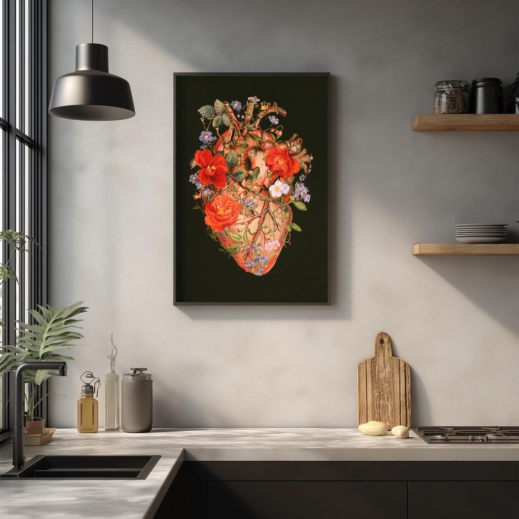 a kitchen counter with a framed artwork of a floral heart on the wall above it. The counter also has various kitchen items such as a cutting board, a soap dispenser, and a bottle.