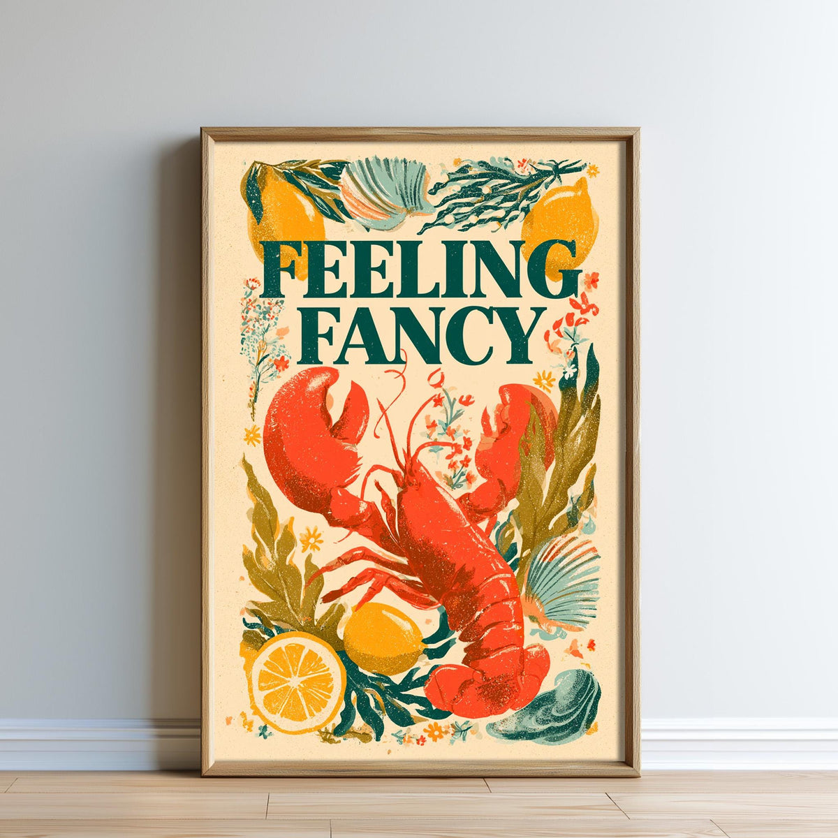 The image is a framed poster featuring an illustration of a lobster surrounded by various fruits and vegetables, with the text "Feeling Fancy" prominently displayed.