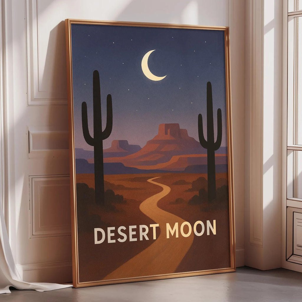 A framed poster depicting a desert landscape with a cactus in the foreground and a crescent moon in the night sky, with the text "DESERT MOON" below the cactus.