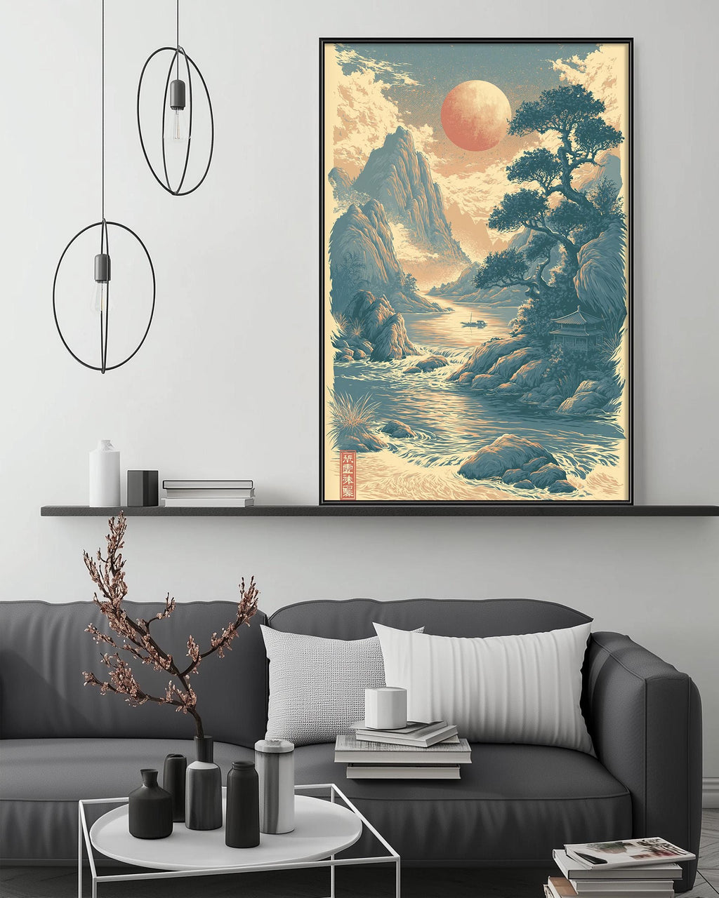a living room with a gray sofa, a coffee table, and a large framed landscape painting hanging on the wall above the sofa.