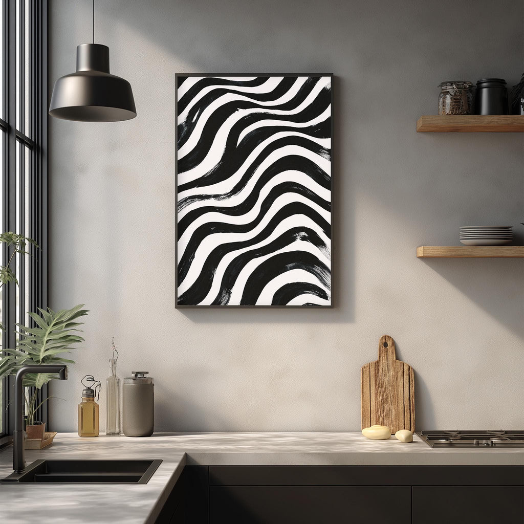 a modern kitchen with a black and white abstract painting hanging on the wall above a wooden cutting board and a sink.