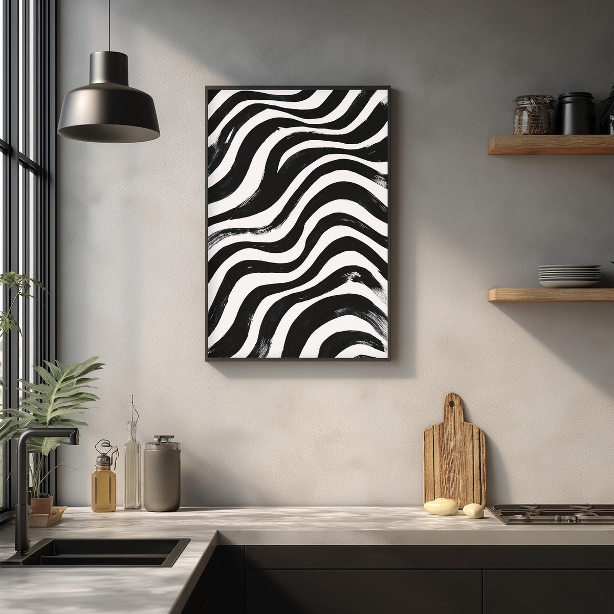a modern kitchen with a black and white abstract painting hanging on the wall above a wooden cutting board and a sink.