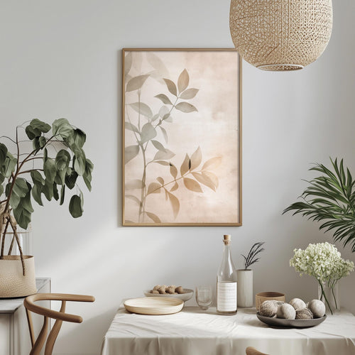 a serene and minimalist dining area with a table set for two, featuring a bowl of fruit, a bottle of wine, and a vase of flowers. The table is draped in a white tablecloth, and a framed picture of leaves hangs above it. The room is decorated with potted plants and a woven light fixture, creating a calm and inviting atmosphere.