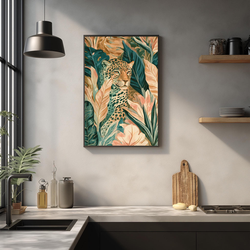 a kitchen counter with a framed painting of a leopard surrounded by tropical foliage hanging above it. The painting is placed on a white wall, and the kitchen counter has various items on it, including a cutting board, a bottle, and a vase.