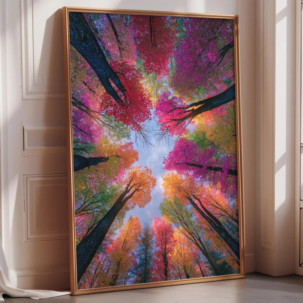a large, framed picture of a vibrant, colorful forest scene with trees displaying a variety of autumn colors.