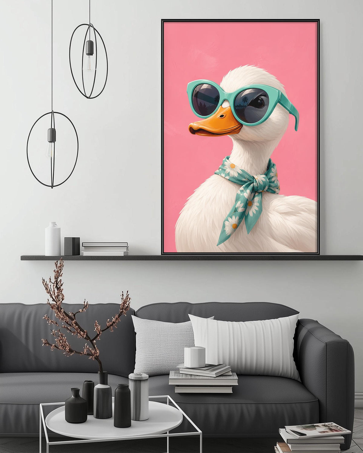 a large, colorful painting of a duck wearing sunglasses and a scarf, hanging on a wall above a gray couch in a living room setting.