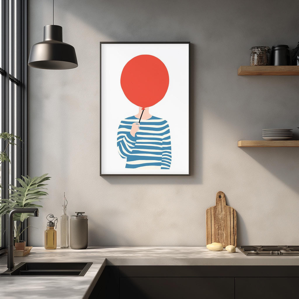 a kitchen counter with various items such as a cutting board, a bottle, and a plant. Above the counter, there is a framed illustration of a person holding a red circle, which appears to be a stylized representation of a person's head.