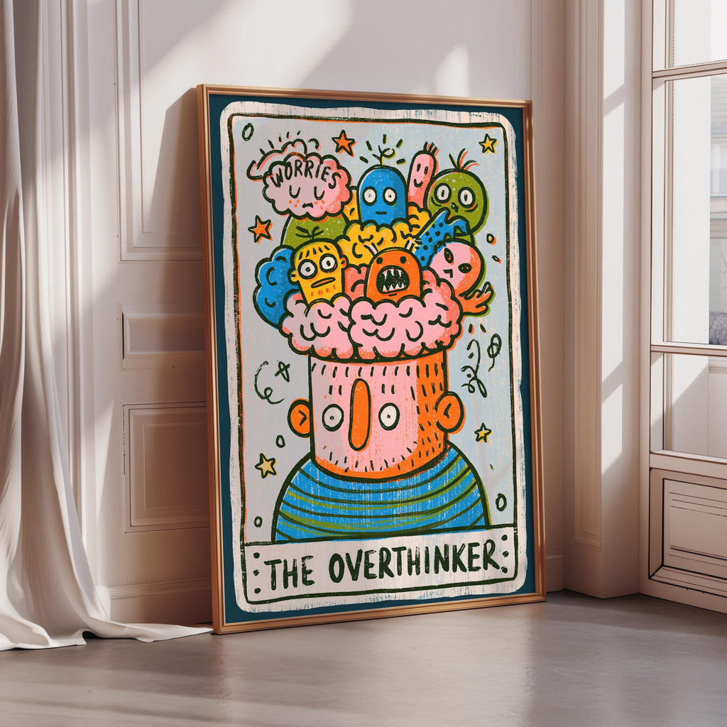 The image is a framed artwork depicting a whimsical, cartoonish character with a large head and a wide smile, surrounded by various colorful and whimsical elements.