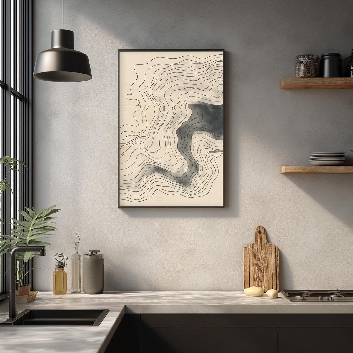 a modern kitchen with a minimalist design. The kitchen has a large window that allows natural light to flood the space, and a wooden cutting board is placed on the counter. A framed abstract drawing is hanging on the wall above the counter, adding an artistic touch to the room. The kitchen also has various kitchen items, such as a sink, a bottle, and a vase, contributing to the overall aesthetic.