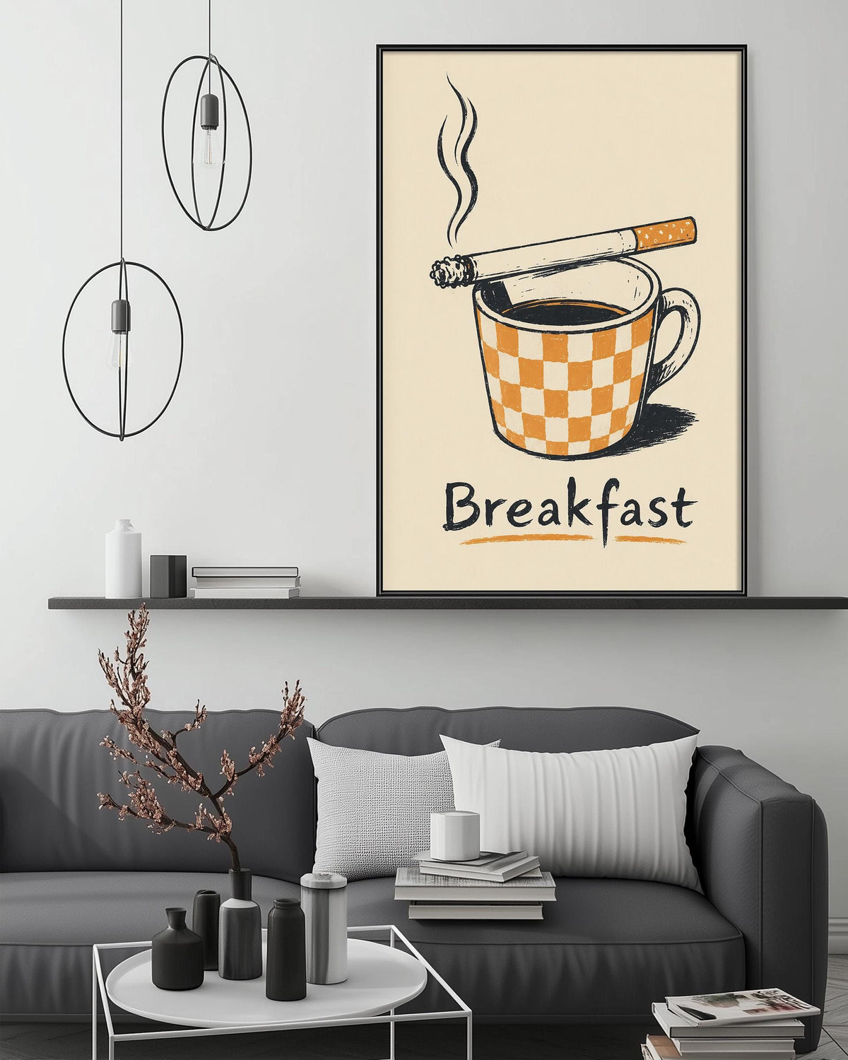a cozy living room with a gray sofa, a coffee table, and a framed poster of a cup of coffee with a cigarette on top. The poster has the word "Breakfast" written on it.