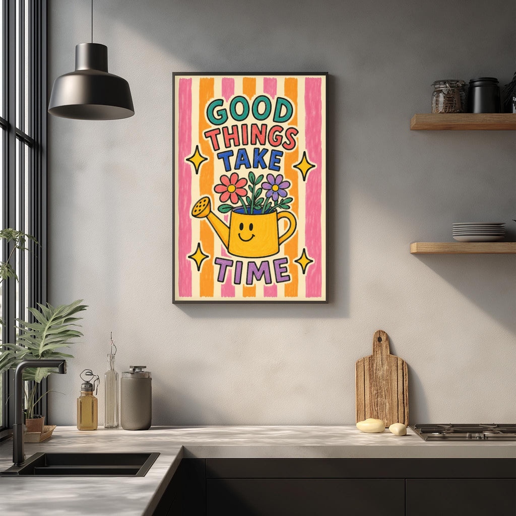 a kitchen counter with a framed poster hanging on the wall above it. The poster has a colorful design with a smiling face and the text "GOOD THINGS TAKE TIME" written on it.