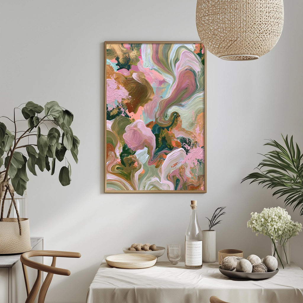 a dining table with a white tablecloth, a bowl of fruit, a bottle, and a vase with flowers. Above the table, there is a framed abstract painting with a colorful, swirling design.
