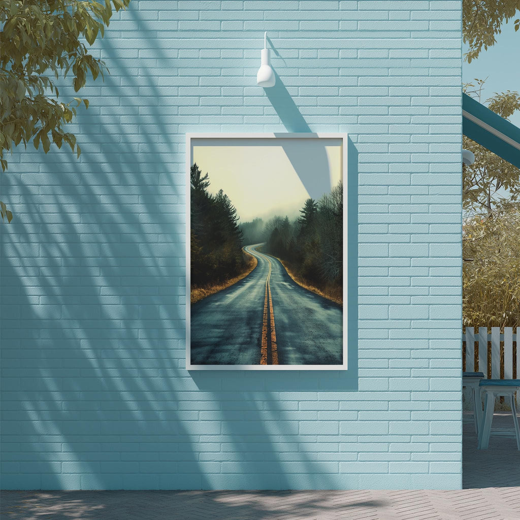 a blue brick wall with a framed painting of a winding road through a forest.