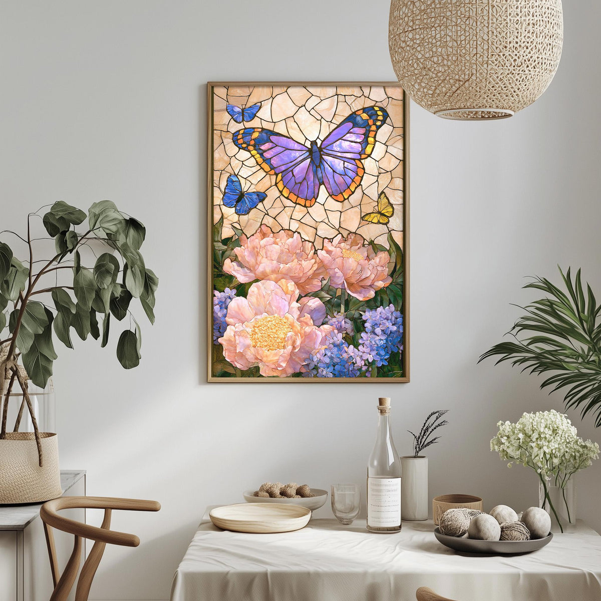 a dining table with a white tablecloth, surrounded by potted plants and a vase of flowers. A framed painting of a butterfly and flowers hangs on the wall above the table.