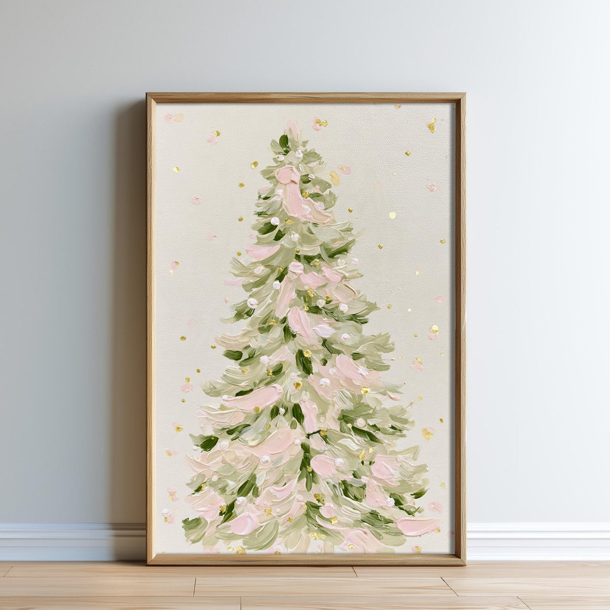 A framed painting of a Christmas tree with green and pink leaves, set against a light background.