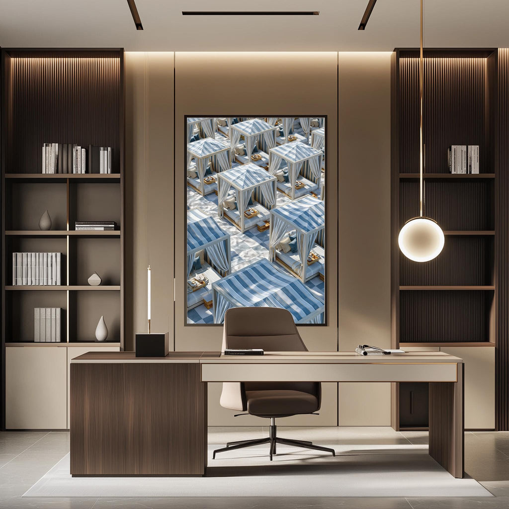 a modern office space with a large window, wooden furniture, and a framed image of beach chairs on the wall.