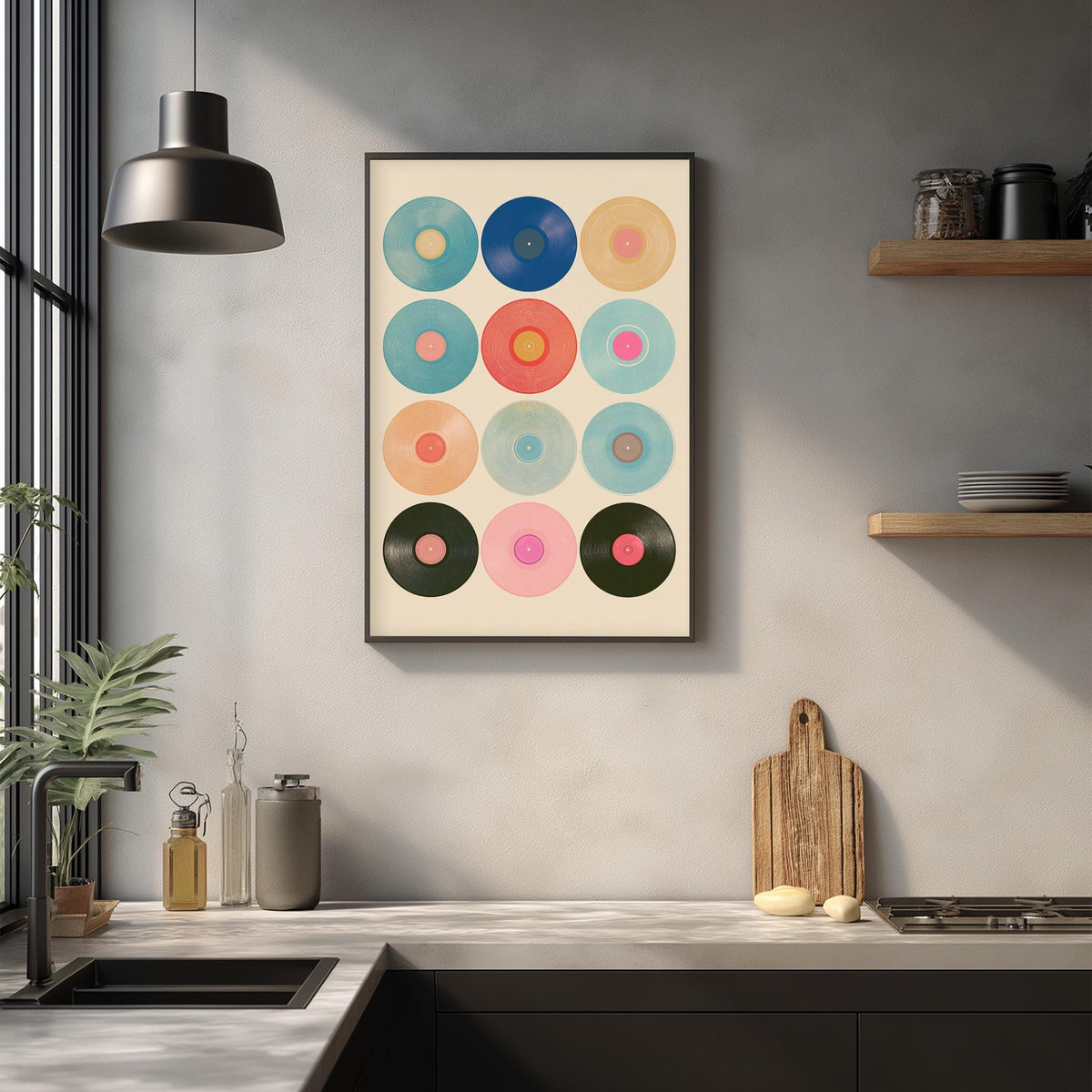 a kitchen counter with various items, including a framed print of colorful circles, a wooden cutting board, and a potted plant.