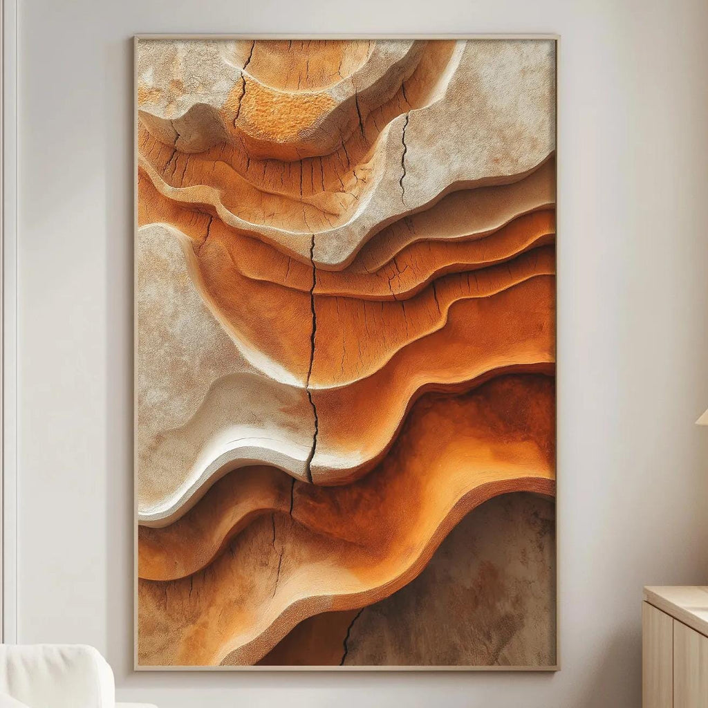a large abstract painting with a striking color palette of orange and brown, hanging on a white wall in a modern living room setting.