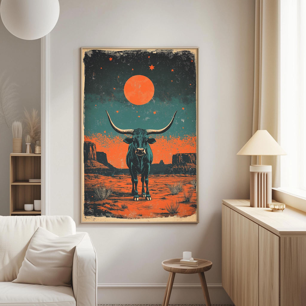 a large framed poster of a bull with horns and a red moon in the night sky, hanging on a wall in a living room.